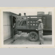 Unloading crates at a warehouse (ddr-densho-37-864)