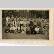 Group photograph in front of barracks (ddr-densho-298-8)