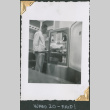Man standing by refrigerator (ddr-densho-434-164)