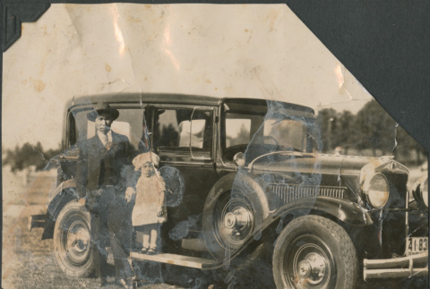 Man and small girl next to car (ddr-densho-483-551)