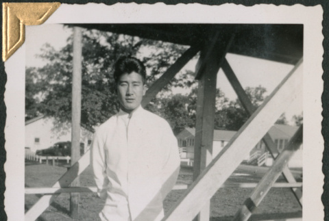 Man standing on wooden walkway (ddr-densho-434-174)