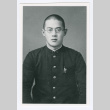 Portrait of person with crew cut and glasses (ddr-densho-1007-66)