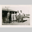 Tsukada Siblings standing outside barracks at Amache (ddr-densho-329-1346)