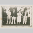 Four men and a women standing on lawn outside house (ddr-densho-316-279)