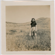 Tomoye (Nozawa) Takahashi standing in a field (ddr-densho-426-1941)