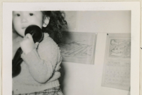 Suzanna holding a phone (ddr-densho-37-971)
