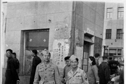 Two service people standing on street (ddr-densho-1007-58)