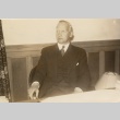 A man seated at a desk (ddr-njpa-1-1995)