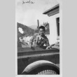 [Man in military uniform with military vehicle] (ddr-csujad-1-34)