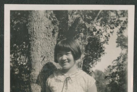 girl next to tree (ddr-densho-378-452)