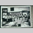 Boys and girls at front of classroom reading (Maryknoll school) (ddr-densho-330-167)
