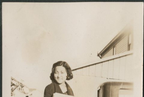 Woman on sidewalk by driveway (ddr-densho-316-213)