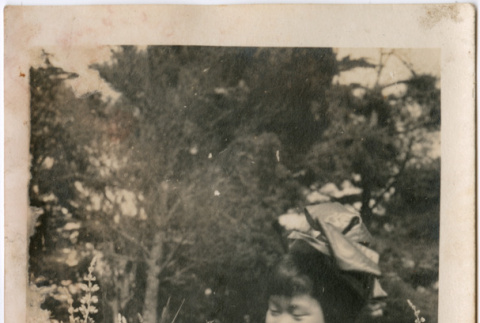 Girl standing in garden (ddr-densho-426-1440)