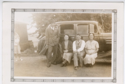 Group in front of a car (ddr-densho-313-33)