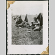 Men sitting in bivouac tents eating (ddr-densho-434-63)