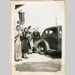 Photo of group standing by car at gas station (ddr-densho-341-66)