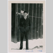 Man poses outside barracks (ddr-densho-363-38)