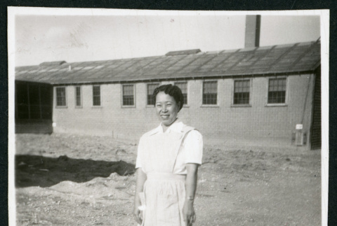 Photograph of a hospital nurse in front of a building (ddr-csujad-47-332)