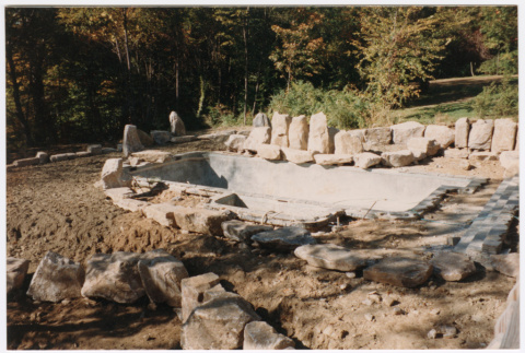 Pool with rock feature under construction (ddr-densho-377-2390)