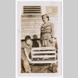 Photo of a woman and child with an animal in a box (ddr-densho-483-732)