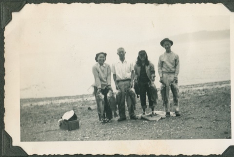 A group holding fish (ddr-densho-321-978)