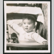 Photo of a child in a high chair (ddr-densho-483-749)