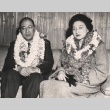 Kosho Otani and his wife seated wearing leis (ddr-njpa-4-1646)