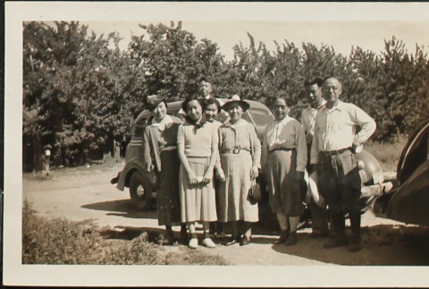 Two Japanese American families on farmland (ddr-densho-259-247)