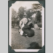 Photo of a man playing with a child (ddr-densho-483-906)