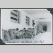 Soldiers sitting outside of a building (ddr-densho-201-791)