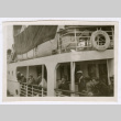 Men looking over railing of ship (ddr-densho-540-136)