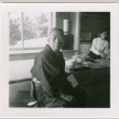 Man seated by low tables (ddr-densho-426-2460)