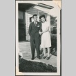 A couple in front of a house (ddr-densho-328-51)