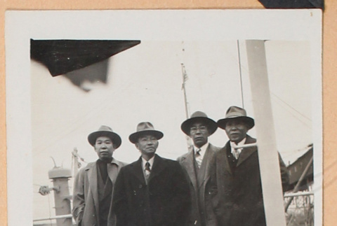 Photo of four men (ddr-densho-483-460)