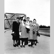 Japanese Americans on a bridge (ddr-densho-34-74)