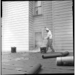 Man laying tarpaper (ddr-densho-426-2172)
