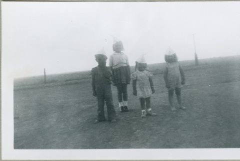 Four children wearing hats (ddr-densho-300-99)