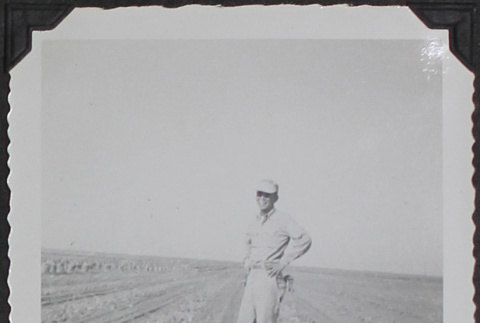 A farmer standing in a field (ddr-densho-300-499)