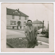 Man standing on a street corner (ddr-densho-463-188)