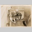 Man with three children on board ship (ddr-densho-426-1563)