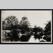 Building surrounded by a pond and garden (ddr-densho-404-142)