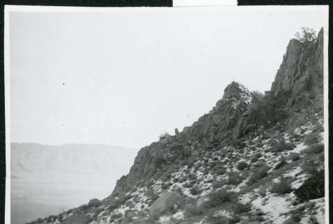 Photograph of the side of a mountain with snow and sagebrush (ddr-csujad-47-292)