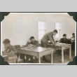 Men studying at desks (ddr-ajah-2-428)