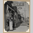 Tokeo Tagami stands outside The Royal Cafe (ddr-densho-404-428)