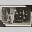 Group of 7 men standing in front of building (ddr-densho-326-342)