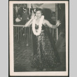 Woman dancing in skirt and lei (ddr-densho-293-169)