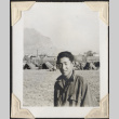 Man with tents in background (ddr-densho-466-709)