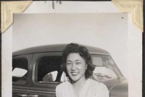 Woman standing next to car (ddr-densho-466-887)