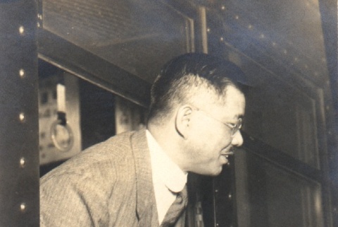 Man leaning out a train window (ddr-njpa-4-2549)