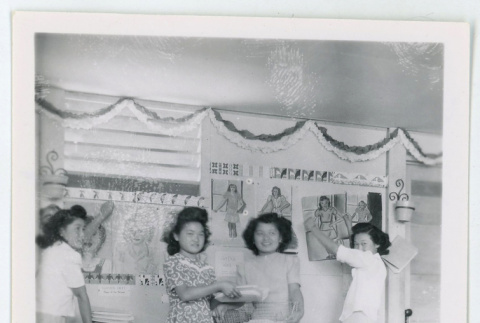 Taking down classroom decorations (ddr-densho-37-2138)